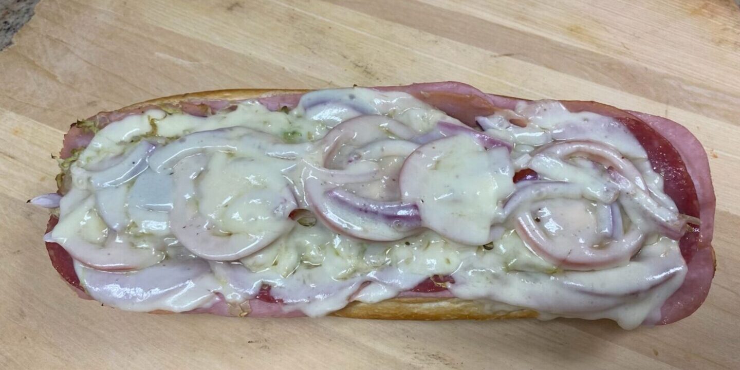 A wooden cutting board with some food on it